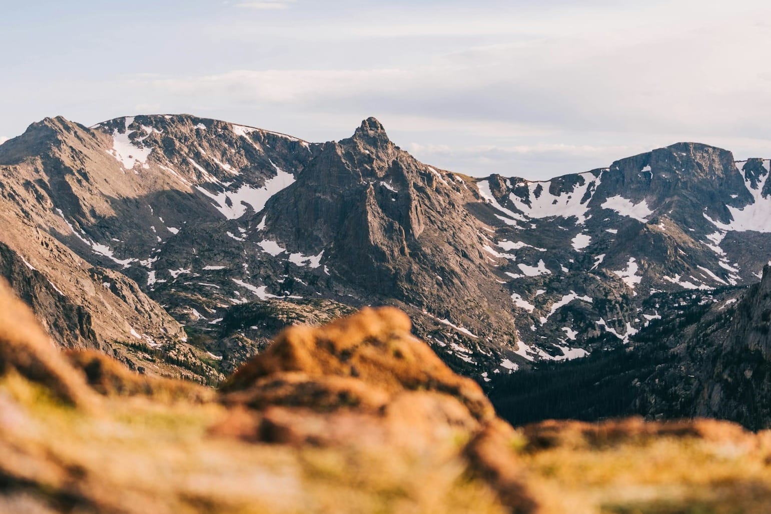 brown and black rocky mountain under white sky during daytime